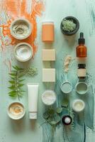 A flat lay of various skincare products arranged artistically on a textured green background photo