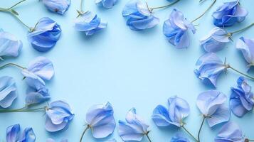 Delicate blue flowers arranged in a circular pattern on a soft blue background, creating a serene atmosphere photo