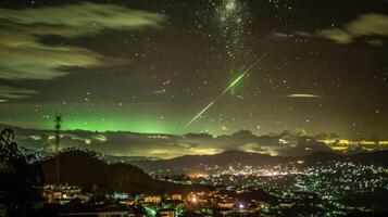 Night sky with meteor streaking over a vibrant cityscape illuminated by lights and clouds photo