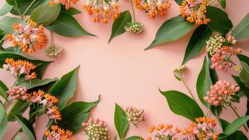 Vibrant floral arrangement featuring orange and pink blossoms on a soft pink background photo