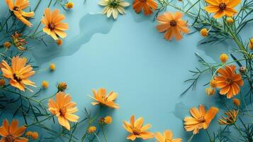 Vibrant orange flowers arranged on a blue surface with droplets, creating a fresh and lively atmosphere photo