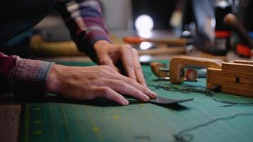 Tailor Working on a Leather Belt in a Well-Equipped Workshop video
