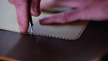Close-Up of Leather Marking with a Template and Awl video
