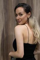 Elegant Blonde in a Black Dress Exuding Confidence and Timeless Beauty. photo
