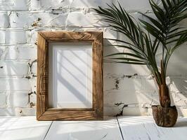 A wooden frame with a plant on a white brick wall photo