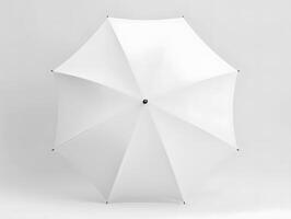 An open white umbrella on a plain surface photo
