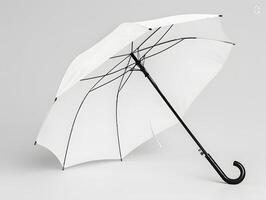 A white umbrella with black handle on a white background photo