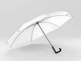A white umbrella with black handle on a gray background photo