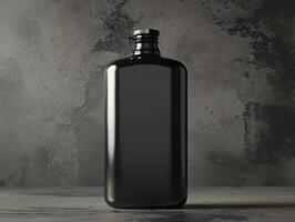 A black bottle sitting on a table with a gray background photo