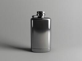 A flask with a metal lid on a gray surface photo