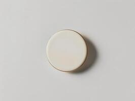 A white circular object on a white surface photo