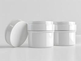 Three white jars with lids on a table photo