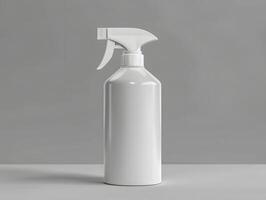 A white spray bottle on a table with a copy space photo