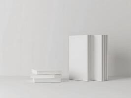 Three white books on a table with a white background photo
