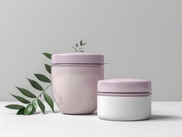 Two jars with white lids and a green plant photo