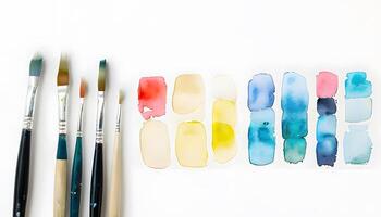 A white surface with a bunch of paint brushes photo