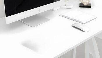 A white desk with a computer, mouse and books photo