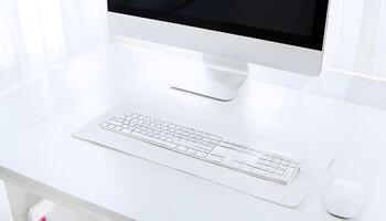 A white desk with a computer and mouse photo