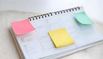 A calendar with sticky notes on it photo