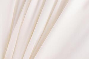 Soft parallel pleats of creamy chiffon fabric. A chic piece of silk fabric. A copy of the space. wedding background. layout photo