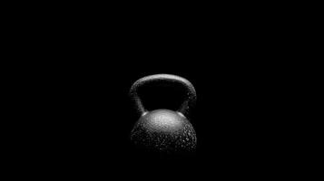 Black kettlebell on a dark background photo