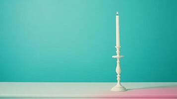 Lit candle in white candlestick photo