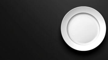 White plate on black background top photo