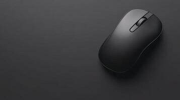 Wireless mouse lying on black surface photo