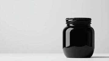 Black jar on white background, minimal photo