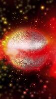 A voluminous red sparkling planet with a metallic tint rotates in outer space video
