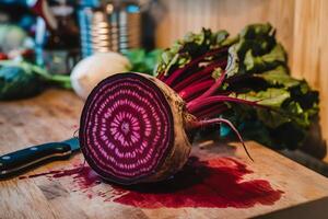 A beet is cut open on a cutting board photo