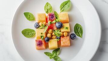 A plate with fruit and vegetables on it photo