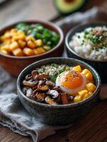 Delicious asian rice bowls with mushrooms, mango, and egg topped with chives photo