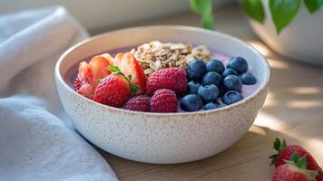 Breakfast bowl with acai berries and granola photo