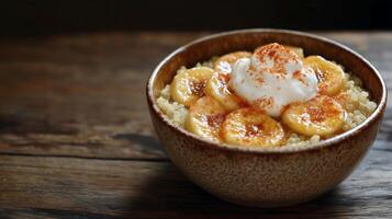 Delicious quinoa breakfast bowl with bananas yogurt and cinnamon for a healthy morning meal photo