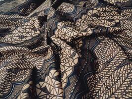 Black and gold patterned fabric with a pattern photo