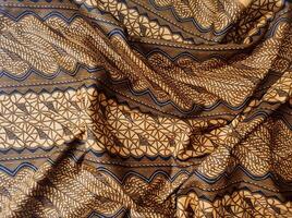 a close up of a brown and black fabric with a pattern photo