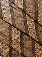 a close up of a brown and black patterned fabric photo
