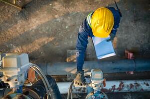 an overhead view of a man in a hard hat and yellow helmet photo