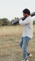 Italian Boy Walks Playing Musical Keyboard On Shoulder In Nature Calabria video