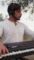 Hands Of A Italian Boy Play The Keyboard Backwards In The Nature video