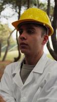 Engineer Gives Orders To Workers In A Forest With Trees video