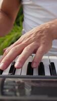Hands Of Man Musician Play Keyboard Outdoors In The Park video