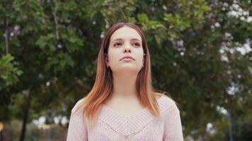 Serious And Indifferent Girl In Front Of People Passing Apathy Concept video