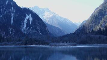 Lake view with snowy mountains as a background. Bipenggou National Park in China video