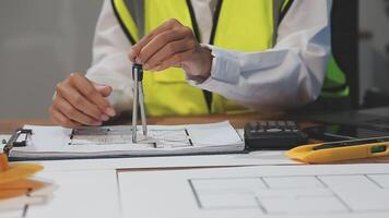 A person in a safety vest is working on a blueprint video
