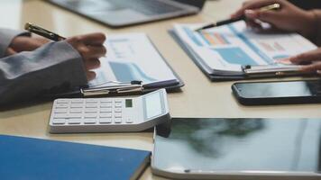 Business people working on paperwork at a desk video