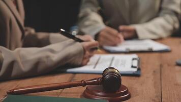 Lawyer and client signing documents on a desk video