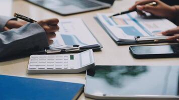 Business people working on paperwork at a desk video