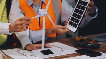 Two people working on a wind turbine video